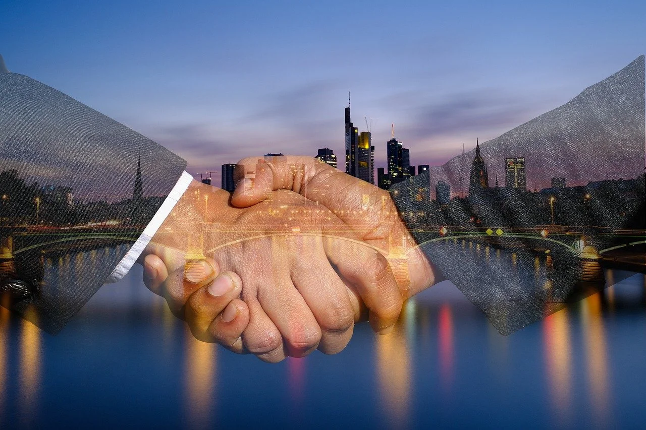 shaking hands, handshake, skyline-3641642.jpg